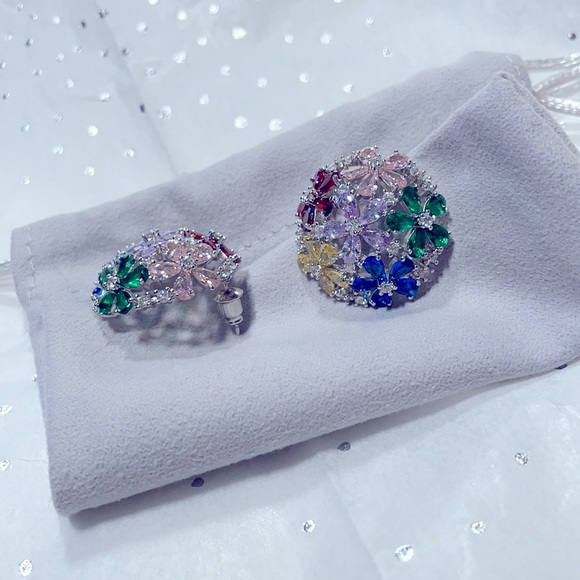 Lovely dome shaped earrings with multi colored glittering cubic zirconia stones.